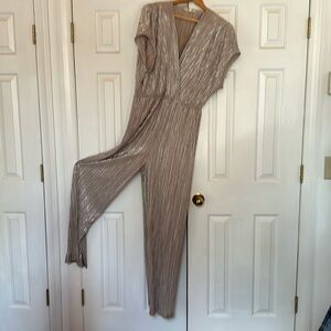 Porridge -Anthropologie metallic jumpsuit. Relaxed fit, elastic waist, wide leg.